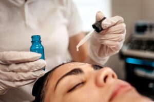 doctor beautician applies oil to the skin of the f 2024 10 21 00 56 26 utc